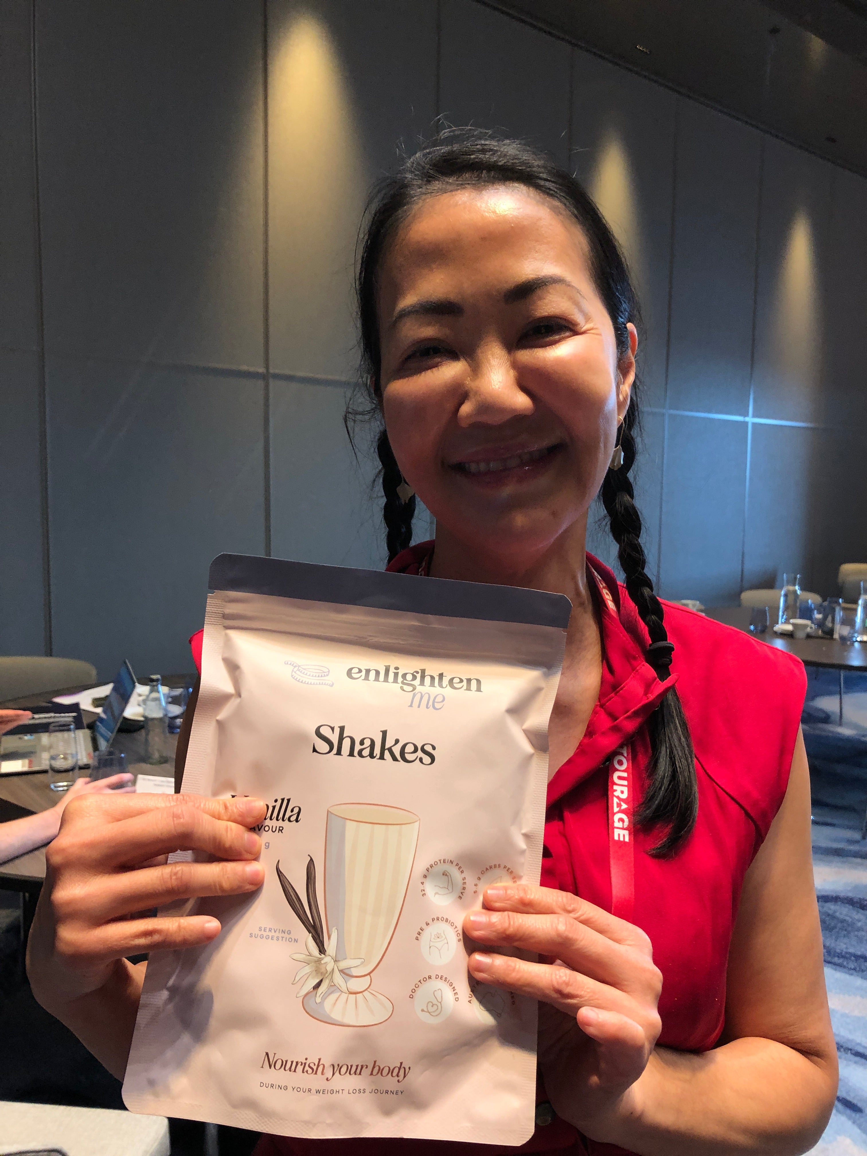 Dr May Marr holding a Vanilla Enlighten Me Shake