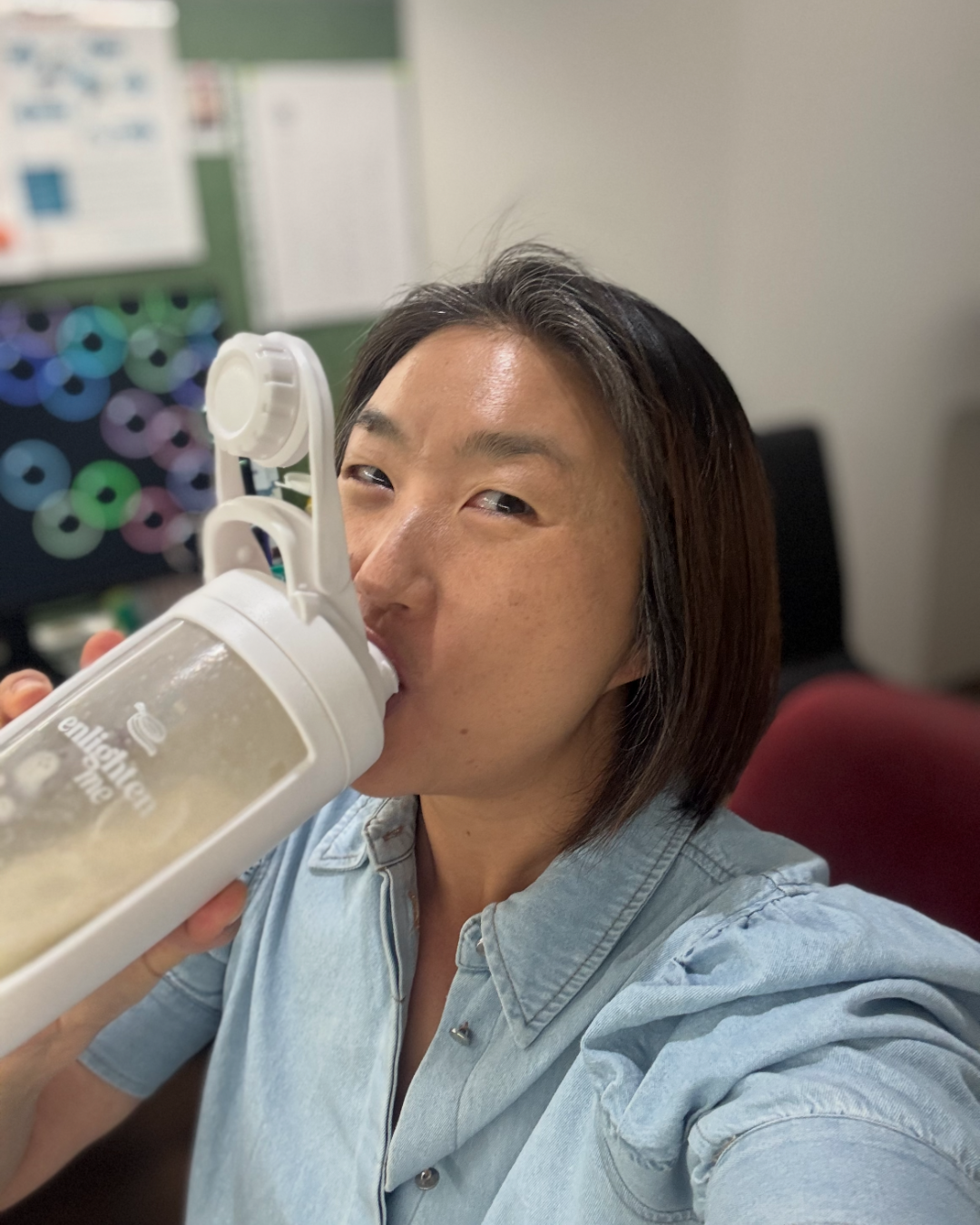 Bo with an Enlighten Me Shake at her desk.