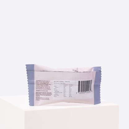 Back of the Enlighten Me Chocolate Protein Ball wrapper, showing the nutritional facts panel, ingredients and allergen information.