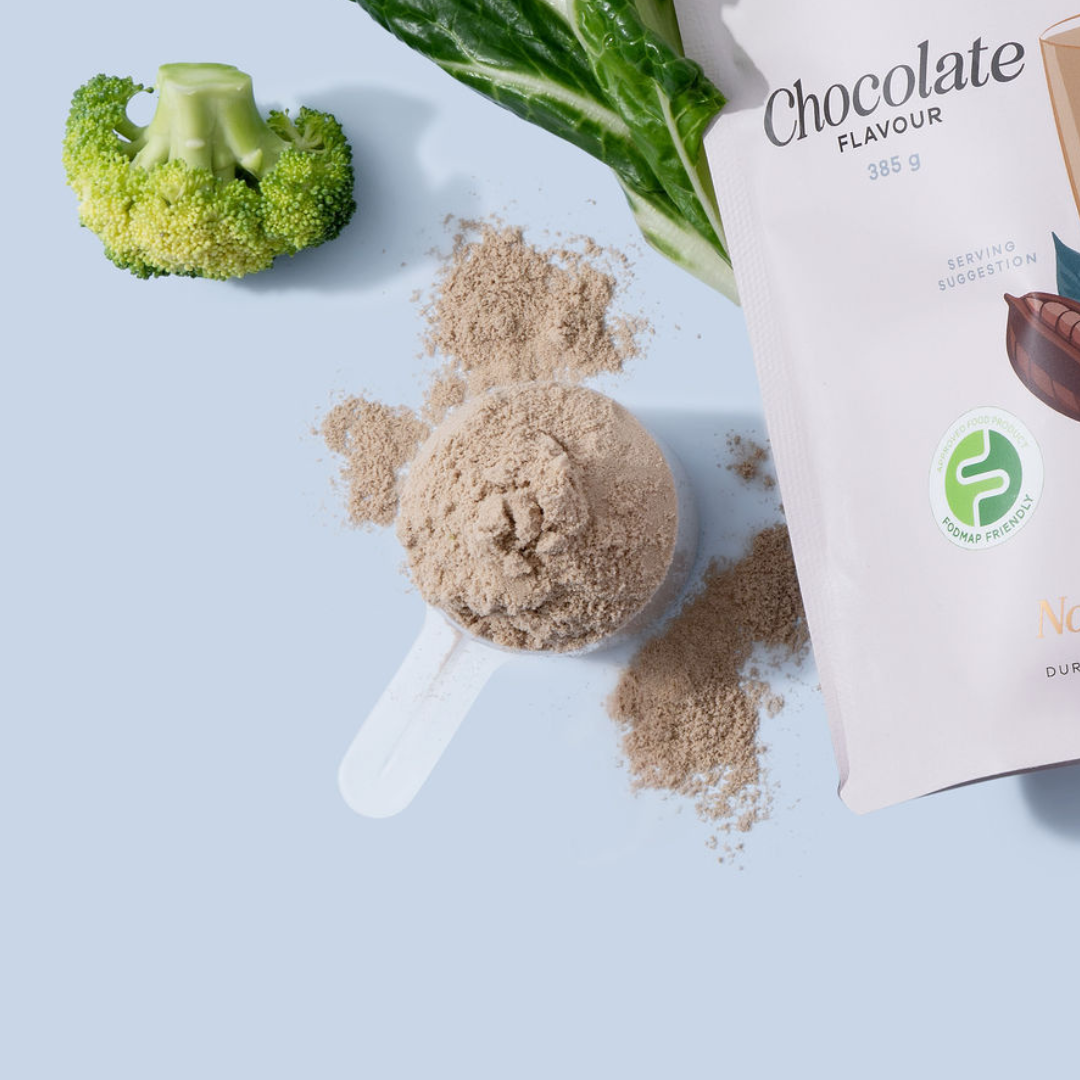 A scoop of the Enlighten Me Shake in chocolate flavour, a FODMAP Friendly inulin free meal replacement shake.