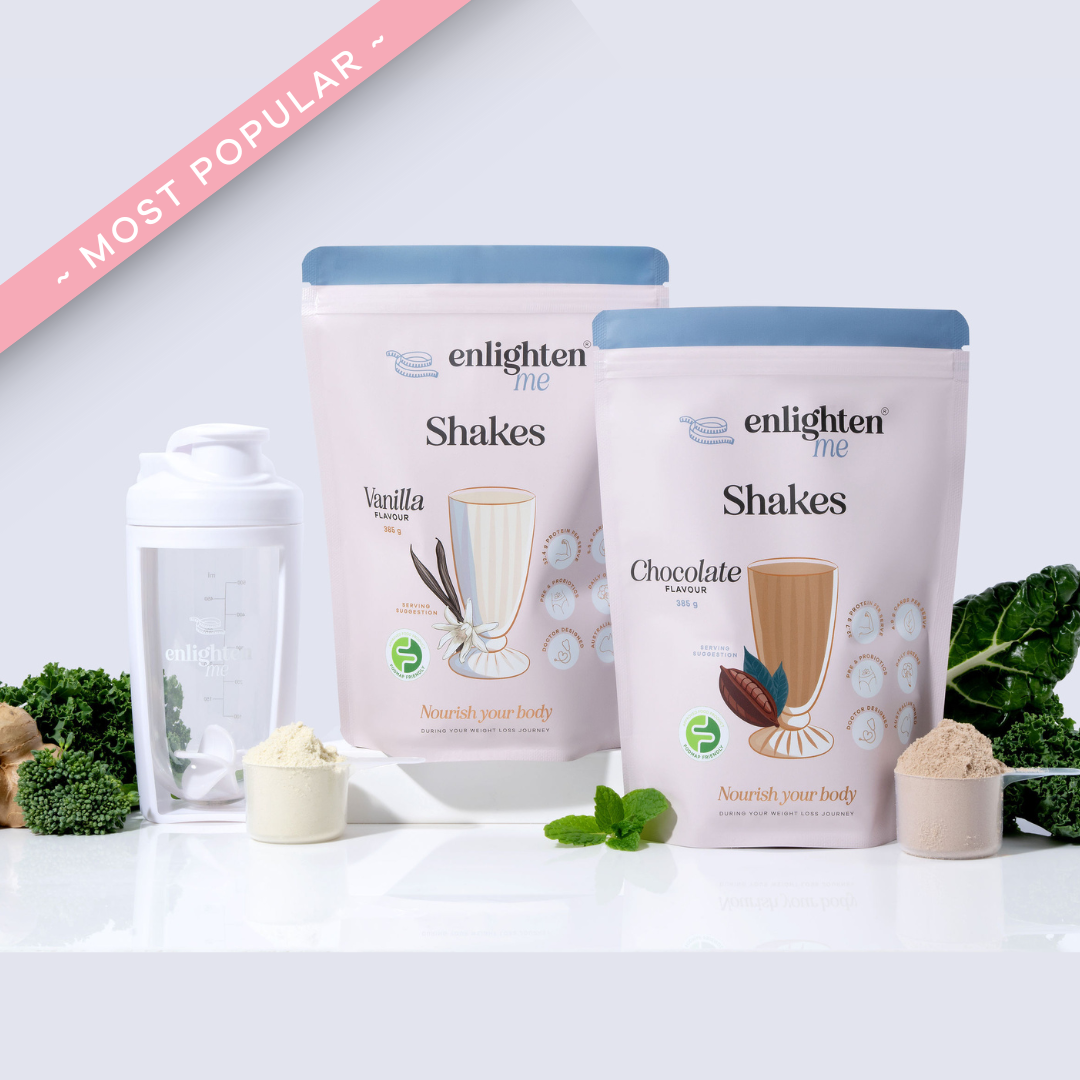 Two bags of 'enlighten me' shakes with a white shaker and ingredients on a white background.